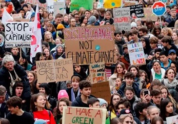 Climate protesters in Lausanne, Switzerland, days before the start of the Davos summit. Photograph: Stefan Wermuth/AFP via Getty Images