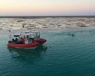 Issuing permits for human activities at larger scales than the particular individual marine features of interest, such as reefs or islands, is part of effective management. Credit: Graeme Cumming