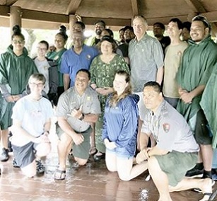 Congresswoman Amata and U.S. Mint Director David Ryder joined a hardworking team from the Park sheltering from a tropical rain in Feb. 2020. National Park Week is being celebrated this week. [courtesy photo]