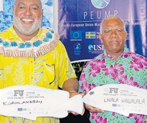 Minister for Fisheries Semi Koroilavesau and 4FJ Movement Champion Lisala Waqalala with their pledge boards at the launch. Credit - https://www.fijitimes.com/