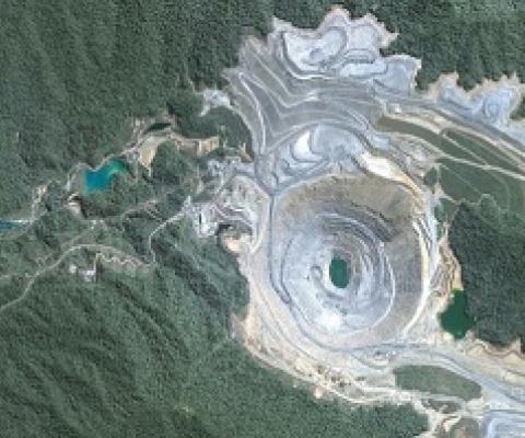 An aerial view of the Batu Hijau open pit gold mine in Indonesia. Photo: SkyTruth, (CC BY-NC-SA 2.0)