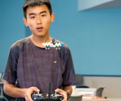 Andrew Lu flies a Tiny Whoop aircraft during a UAV flight mechanics workshop held at the University of Guam in May 2019. Credit - University of Guam