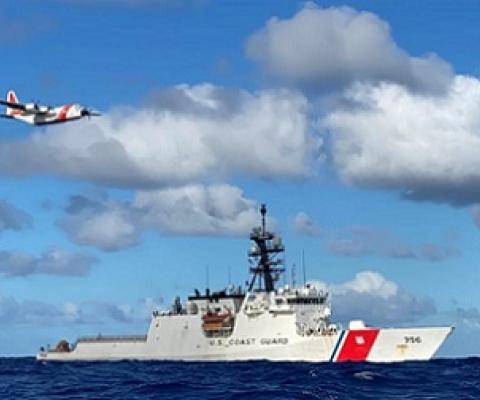 The crews of the Coast Guard Cutter Kimball (WMSL 756) and an Air Station Barbers Point HC-130 Hercules airplane conduct joint operations in the Pacific August 14, 2020. The crews were participating in the multi-country maritime Operation Nasse designed to prevent Illegal, unregulated or unreported (IUU) fishing in Oceania. Credit - U.S. Coast Guard