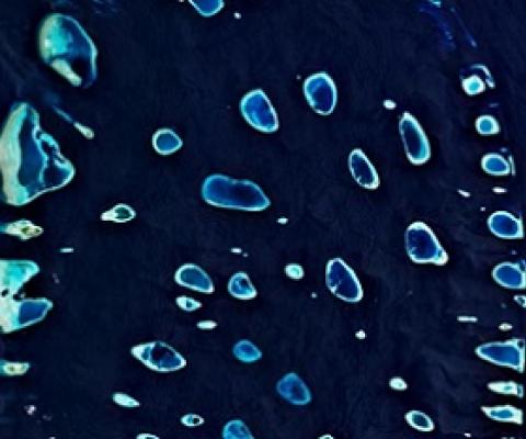 The Maldives, seen in part from above, is comprised of 1,192 islands. The tiny island nation also has the world’s highest levels of microplastics in its beach sand and offshore waters. PHOTOGRAPH COURTESY EUROPEAN SPACE AGENCY