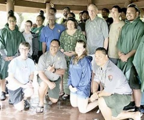 Congresswoman Amata and U.S. Mint Director David Ryder joined a hardworking team from the Park sheltering from a tropical rain in Feb. 2020. National Park Week is being celebrated this week. [courtesy photo]