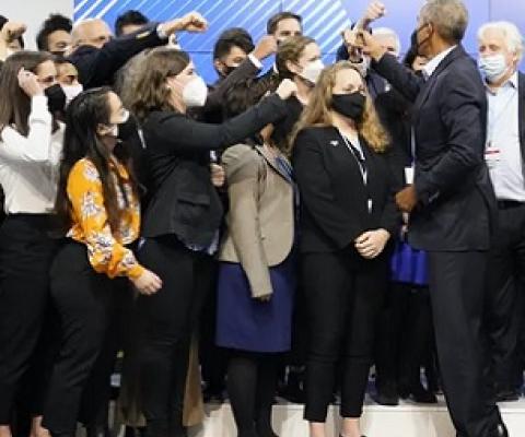 Former US president Barack Obama greets people at COP26 – where negotiators are seeking global progress on climate action. Credit - AP