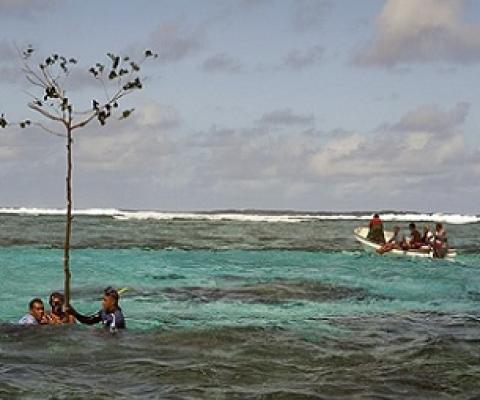 Customary fishing-rights holders from Totoya Island, Fiji, marking a sacred reef area as a no-fishing zone.Credit: Keith Ellenbogen