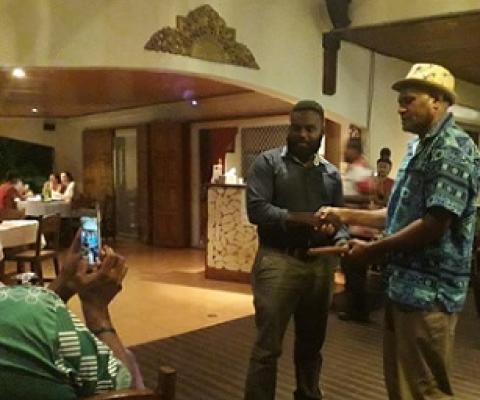 PEBACC Consultant Manager, Bani Arudovo (r) handing over the tokens of appreciation and support to Director of Climate Change and Disaster Risk Reduction, Mr. Mike Waiwai (l)