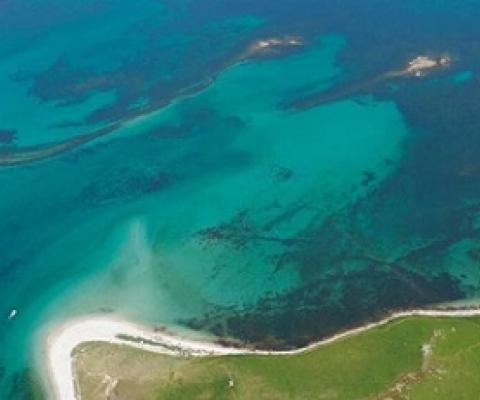 Aerial photograph of submerged stone field boundaries on Samson Flats, Isles of Scilly. Credit: Historic England Archive