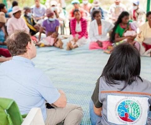 Minister Raharinirina and British Ambassador David Ashley discuss efforts to slow deforestation with people living near Madagascar’s rainforest. Credit: Forest4Climate&People, Author provided