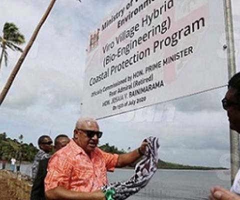 Prime Minister Voreqe Bainimarama commissions the Viro Village Hybrid (Bio-Engineering) Coastal Protection Programme at the village in Ovalau on July 15, 2020. He is accompanied by Minister for Waterways and Environment Mahendra Reddy (right). Photo: Kelera Sovasiga