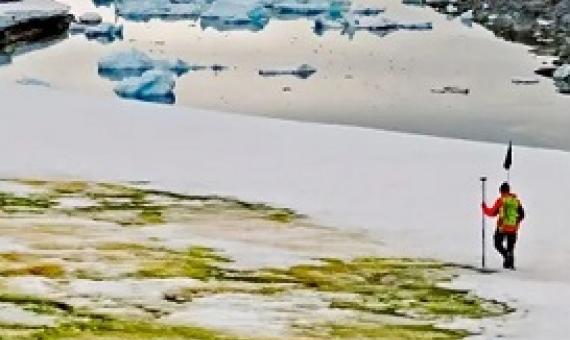  Study author Andrew Gray geotagging the snow algae blooms. Photograph: Dr Matt Davey/University of Cambridge/SAMS/AFP via Getty Image