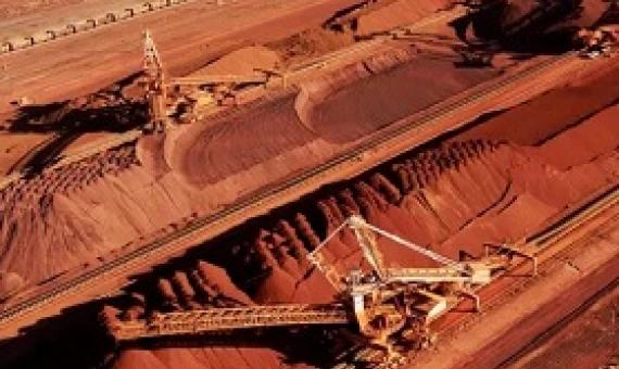  Iron ore is stockpiled for export at Port Hedland in Western Australia. BHP Billiton is on the cusp of destroying 86 Aboriginal sites in the central Pilbara to expand its South Flank iron ore mining operation. Photograph: Bhp Billiton/AFP/Getty Images