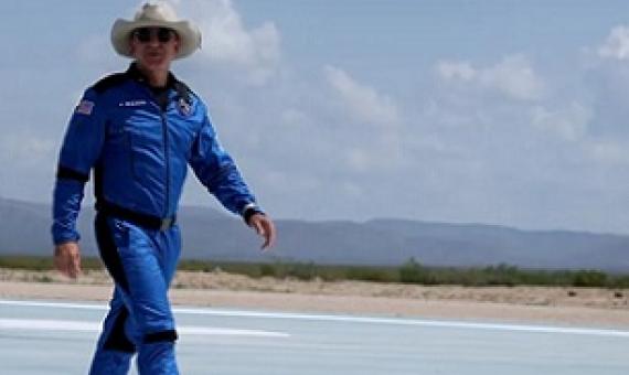 Billionaire Jeff Bezos walks on the tarmac near the Blue Origin rocket that took him to space on July 20. Joe Raedle/Getty Images