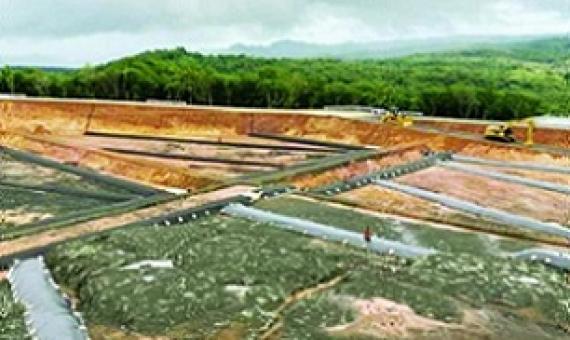 New national landfill and facilities in Aimeliik, built to last for 25 to 30 years. On top of the hill, a base to display four (4) WWII Japanese anti-aircraft artillery recovered from site as part of historical preservation of the site. Credit - Adam Somers