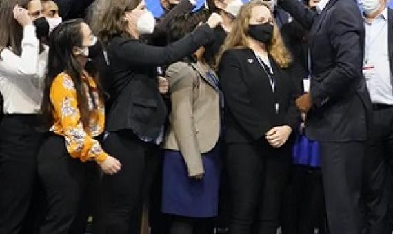 Former US president Barack Obama greets people at COP26 – where negotiators are seeking global progress on climate action. Credit - AP