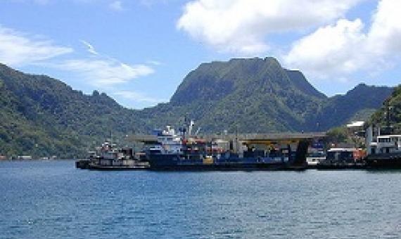 Portion of the dock area at Fagatogo, Pago Pago Harbor, American Samoa with Rainmaker Mt. (Pioa Mtn.) in the background. Credit- Eric Guinther