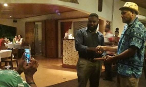 PEBACC Consultant Manager, Bani Arudovo (r) handing over the tokens of appreciation and support to Director of Climate Change and Disaster Risk Reduction, Mr. Mike Waiwai (l)