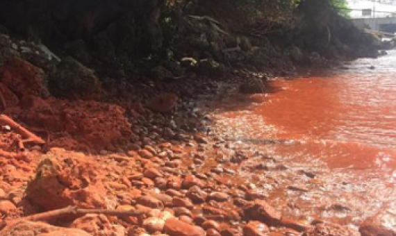 A spill into the bay earlier this year turned the sea red. Photo: Facebook/ Elisha Wesley Mizeu