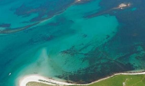 Aerial photograph of submerged stone field boundaries on Samson Flats, Isles of Scilly. Credit: Historic England Archive
