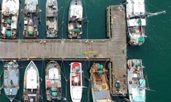 Aerial view of fishing boats at a dock in Southampton, New York. Credit: Jeffrey Blum / Unsplash