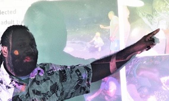 TNC Marine Scientist Simon Peter Vuto explains the work of Rangers at a leatherback turtle workshop. Credit - Ian Kaukui