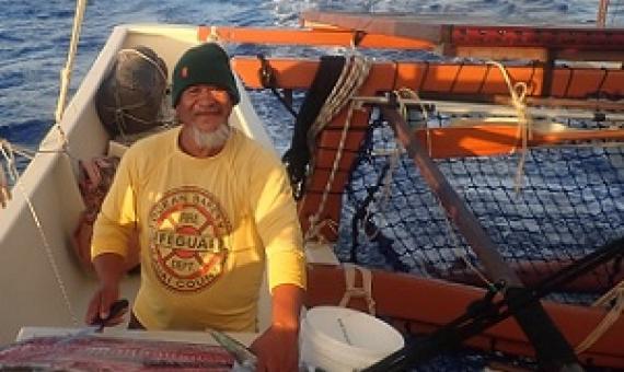 Steve aka ‘Steak’ carves up tuna for the crew of the Marumaru Atua, proving there is some fish out there? Credit - www.cookislandsnews.com