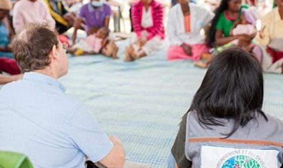 Minister Raharinirina and British Ambassador David Ashley discuss efforts to slow deforestation with people living near Madagascar’s rainforest. Credit: Forest4Climate&People, Author provided